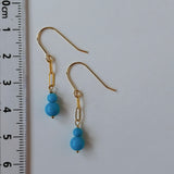 スリーピングビューティーターコイズの丸玉ダブルピアス