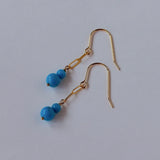 スリーピングビューティーターコイズの丸玉ダブルピアス