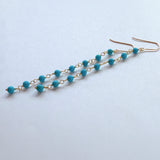 スリーピングビューティーターコイズの丸玉小ステーションロングピアス