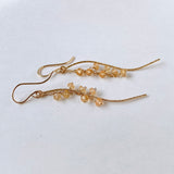 インペリアルトパーズのカービングピアス