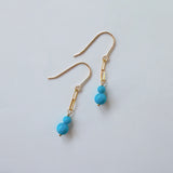 スリーピングビューティーターコイズの丸玉ダブルピアス