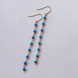 スリーピングビューティーターコイズの丸玉小ステーションロングピアス