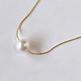 Akoya pearl through necklace