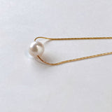 Akoya pearl through necklace