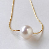 Akoya pearl through necklace