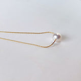 Akoya pearl through necklace