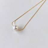 Akoya pearl through necklace