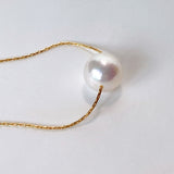 Akoya pearl through necklace