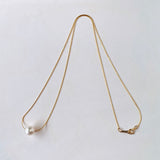 Akoya pearl through necklace